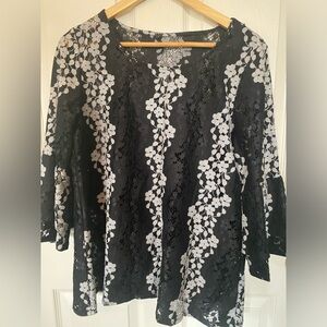 Women blouse with attached black camisole.